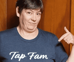 woman modeling slate gray t-shirt with 'tap fam' on it