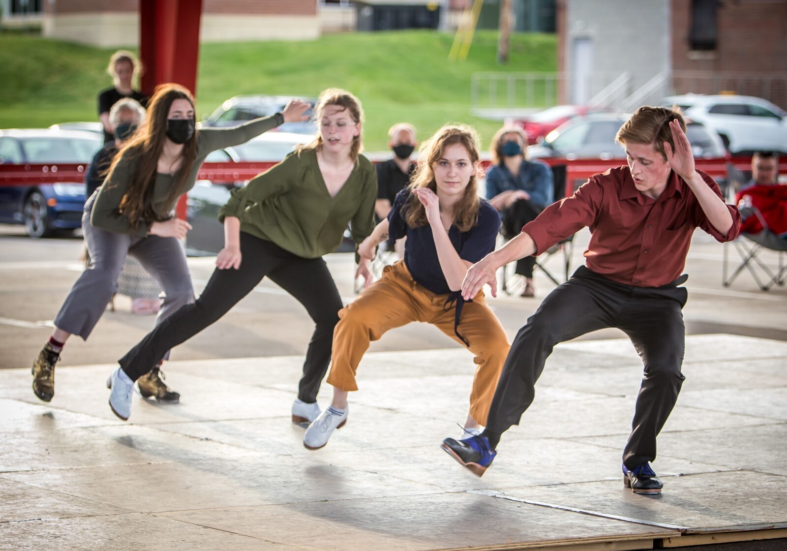 Tapdancers dancing on an outdoor stage