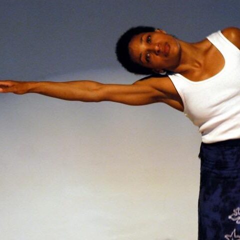 A photo of Roxanne Wallace in a dance pose.