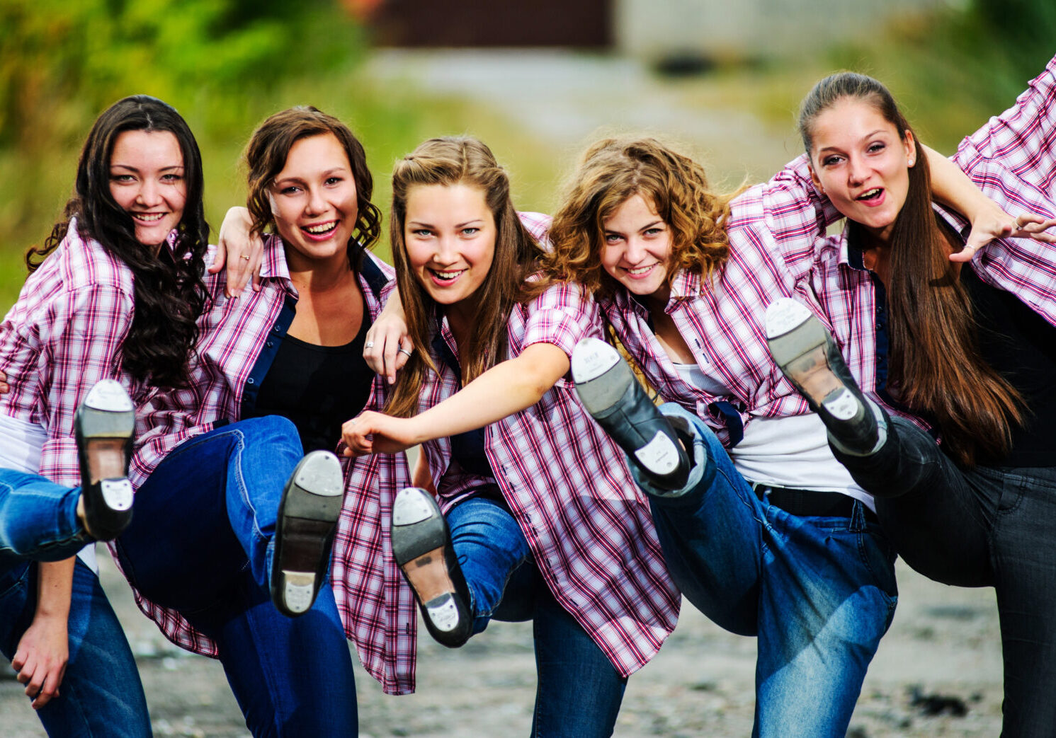 A group of women having fun and kicking up their tap shoes