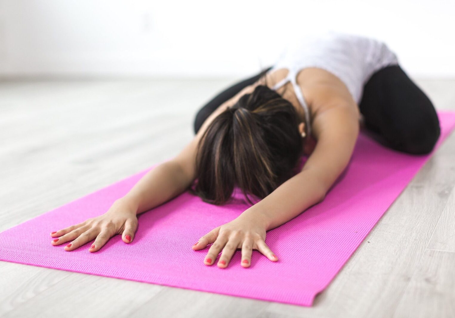 Woman doing child's pose in yoga